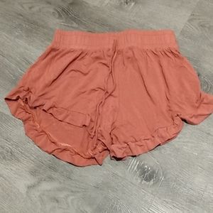 Pink shorts with ruffles on the end